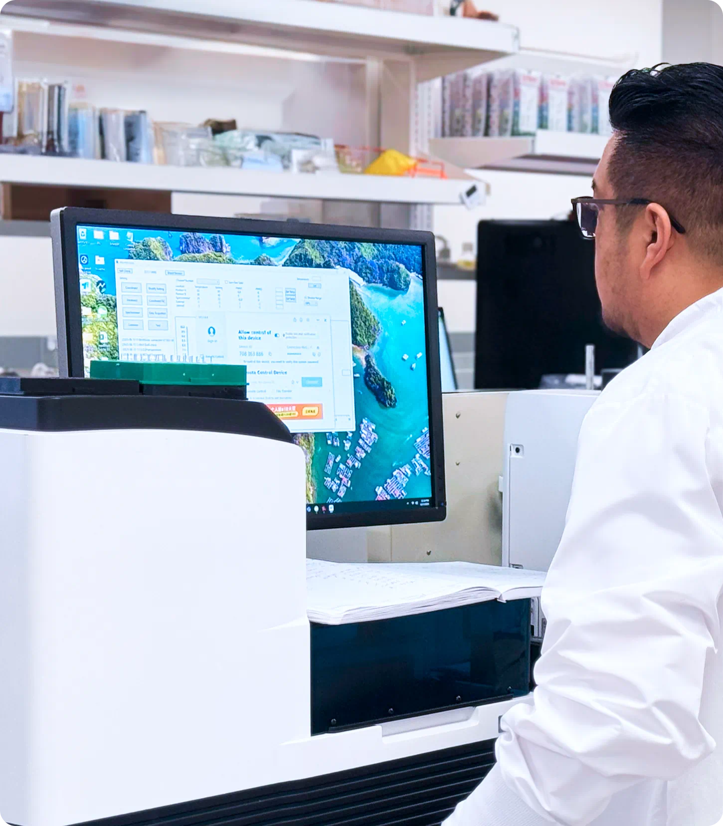Scientist working at a desk with a computer