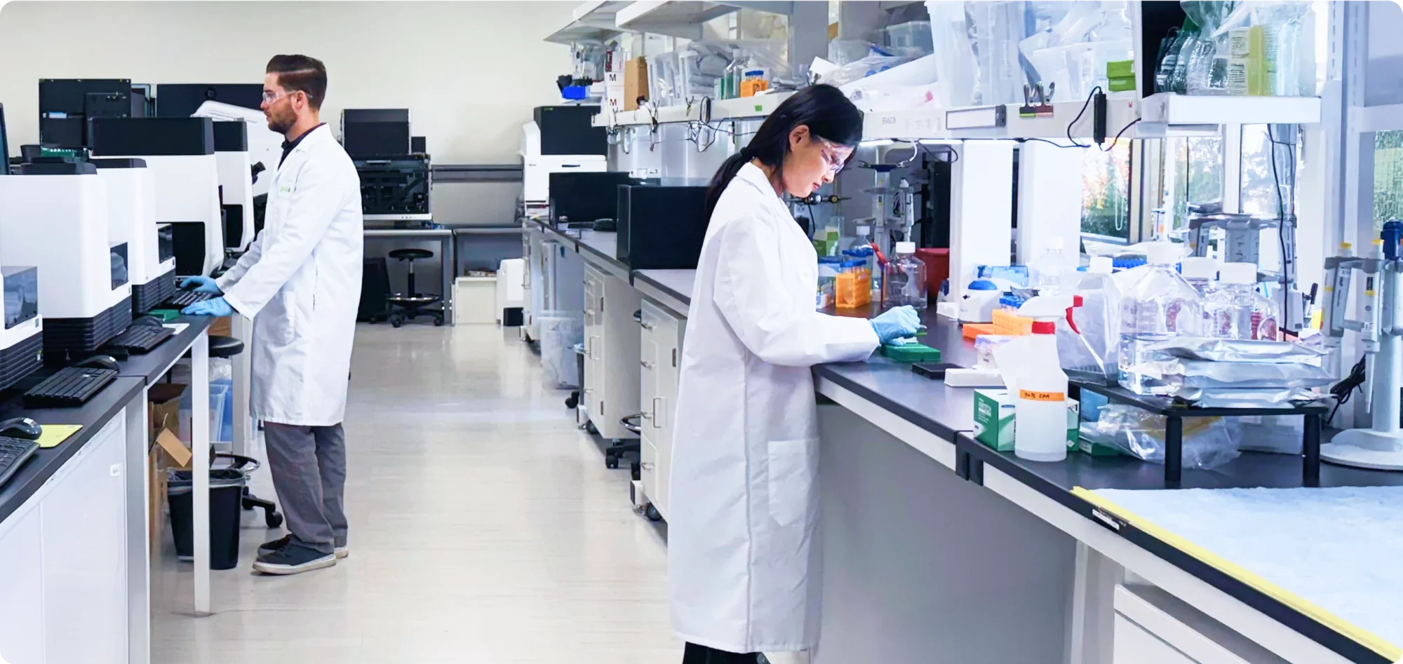 wide shot of a lab and scientists working
