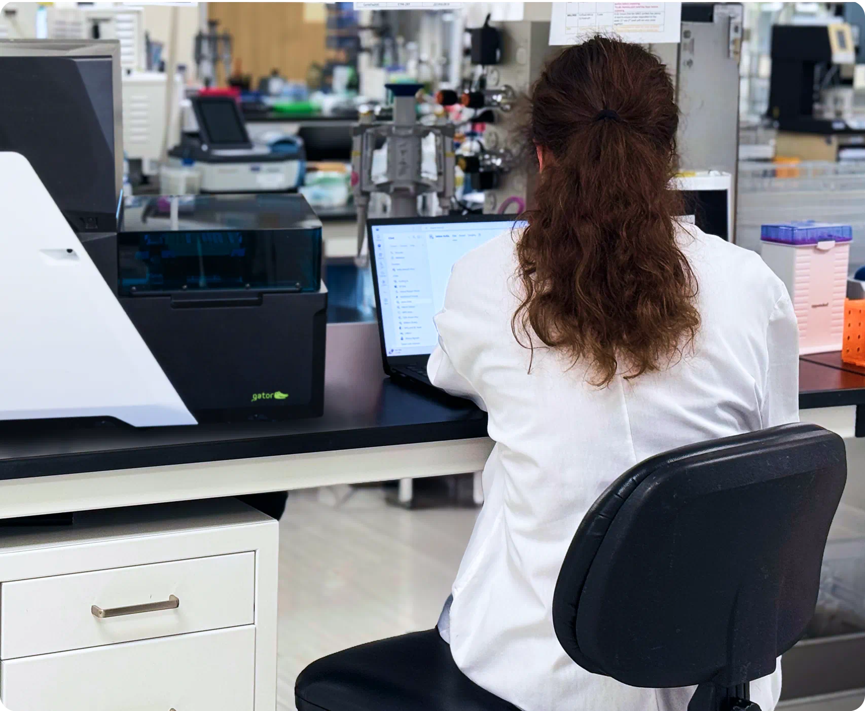 Scientist works at a desk