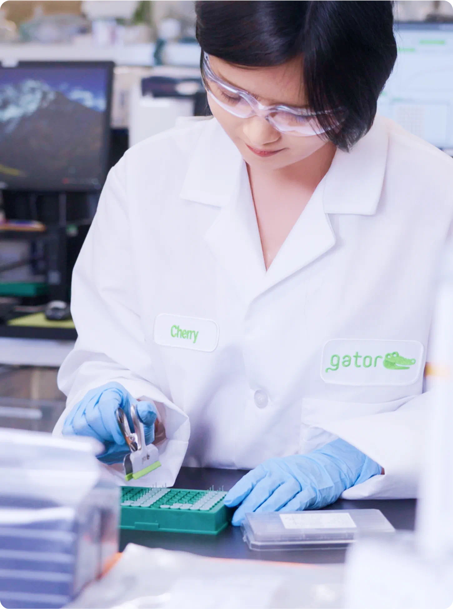 scientist working in a lab with test tubes